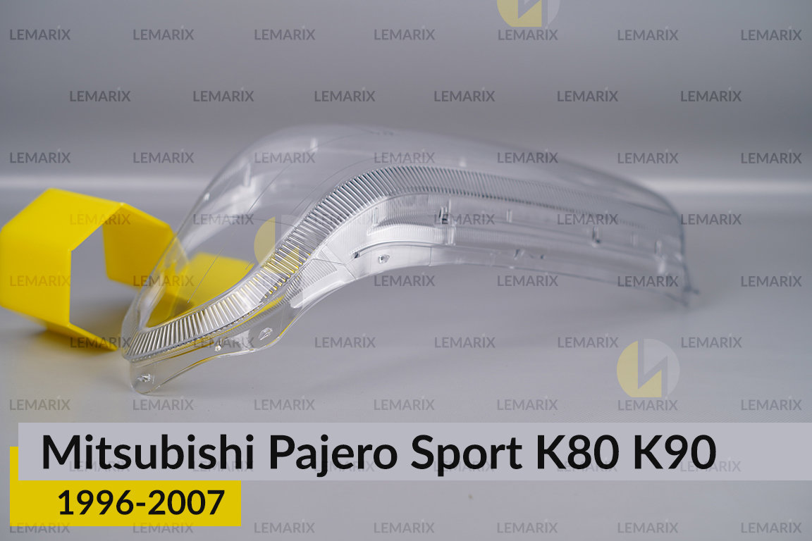 Стекло фары Mitsubishi Pajero Sport K80 K90 (1996-2007) левое