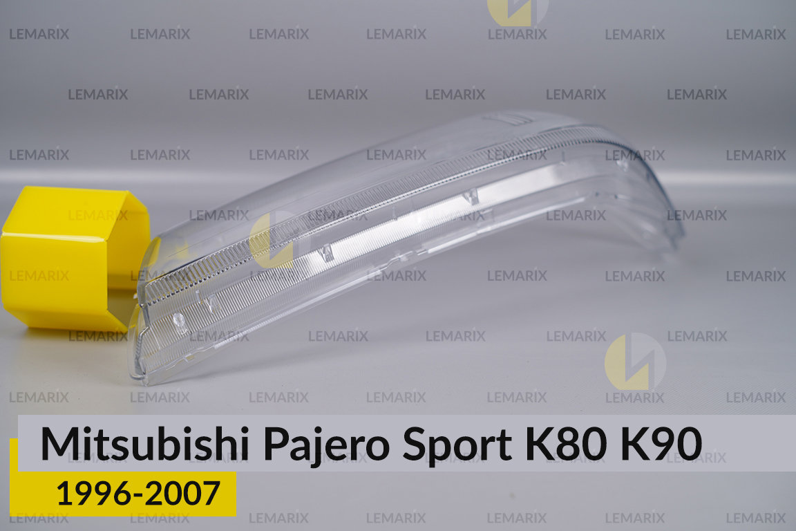 Стекло фары Mitsubishi Pajero Sport K80 K90 (1996-2007) левое