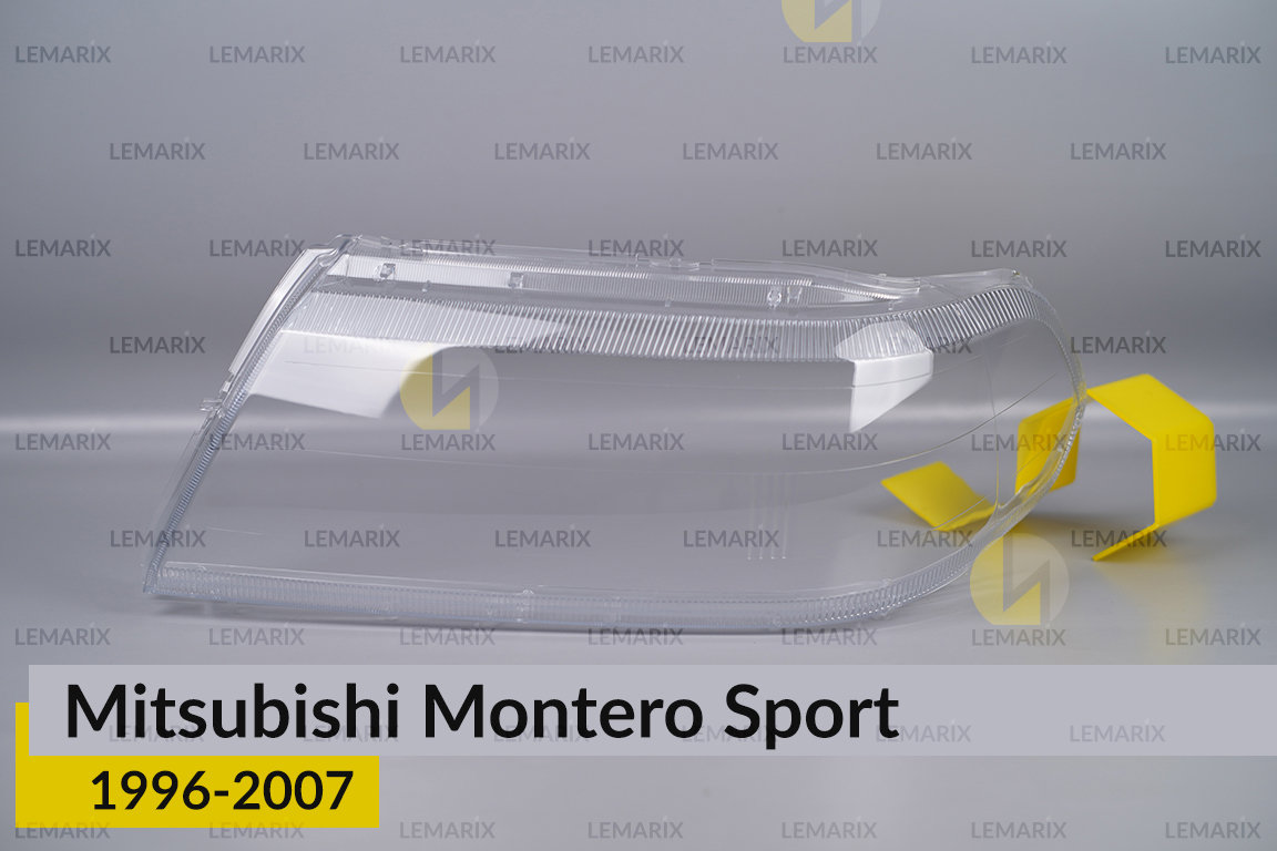 Скло фари Mitsubishi Montero Sport (1996-2007) ліве