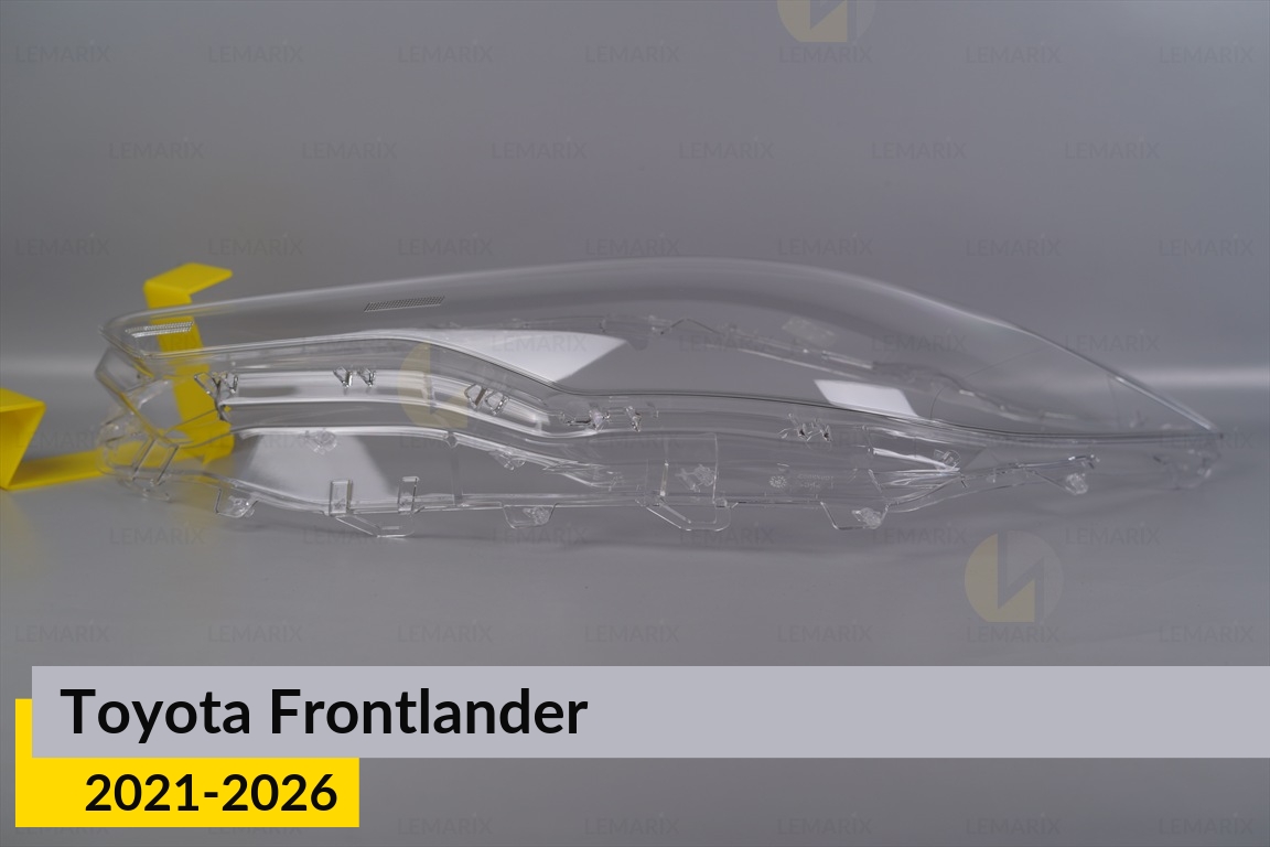 Скло фари Toyota Frontlander (2021-2026) ліве
